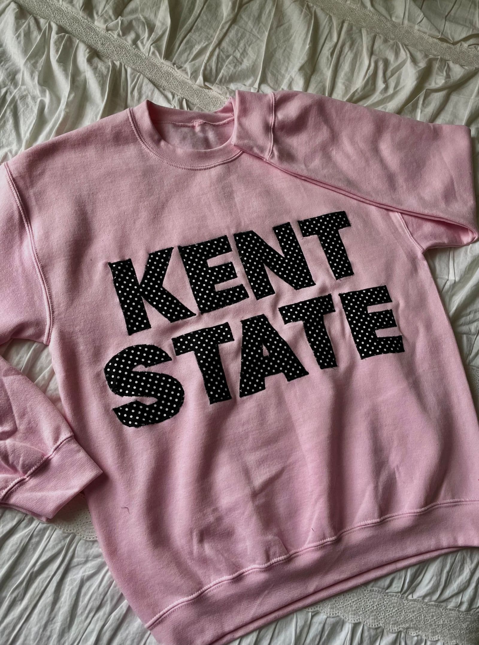 Pink sweatshirt KENT STATE letters in black polka-dot fabric